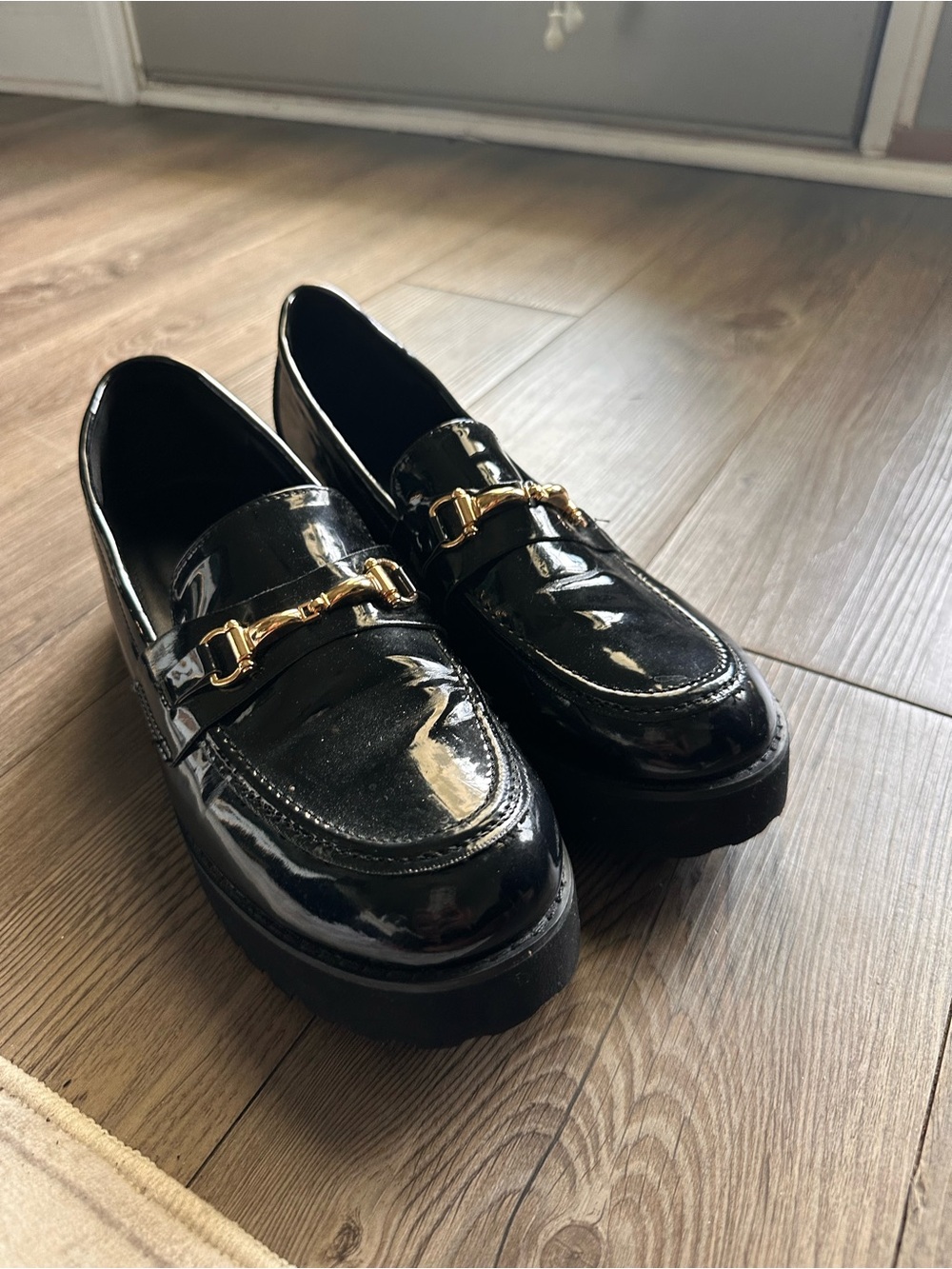 Black Patent Leather Loafers with Gold Bit Accent